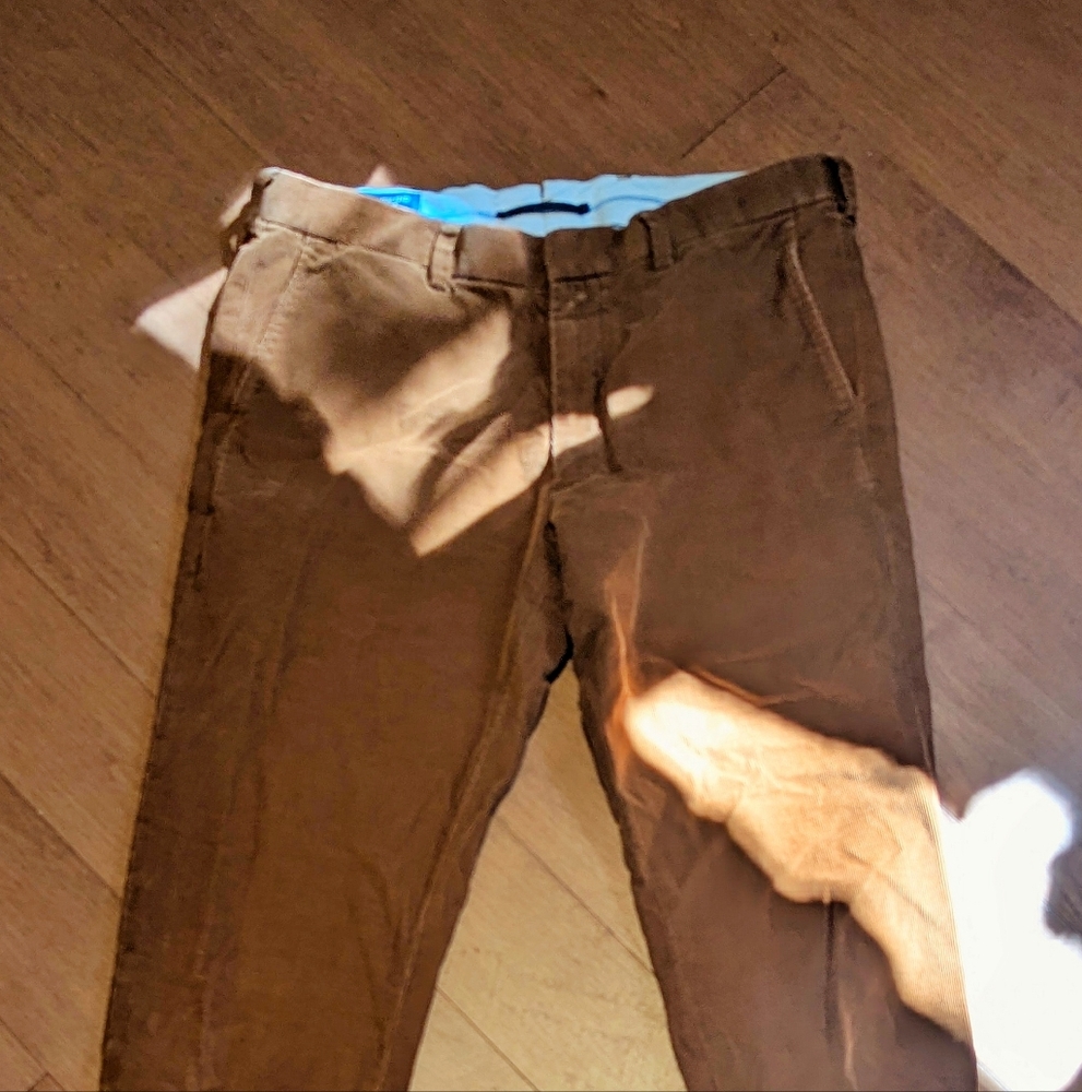 Small light brown corduroy pants.